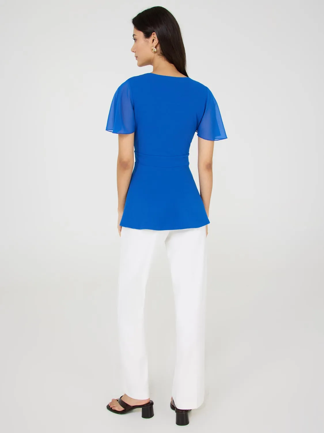 Crossover Peplum Top With Metal Belt