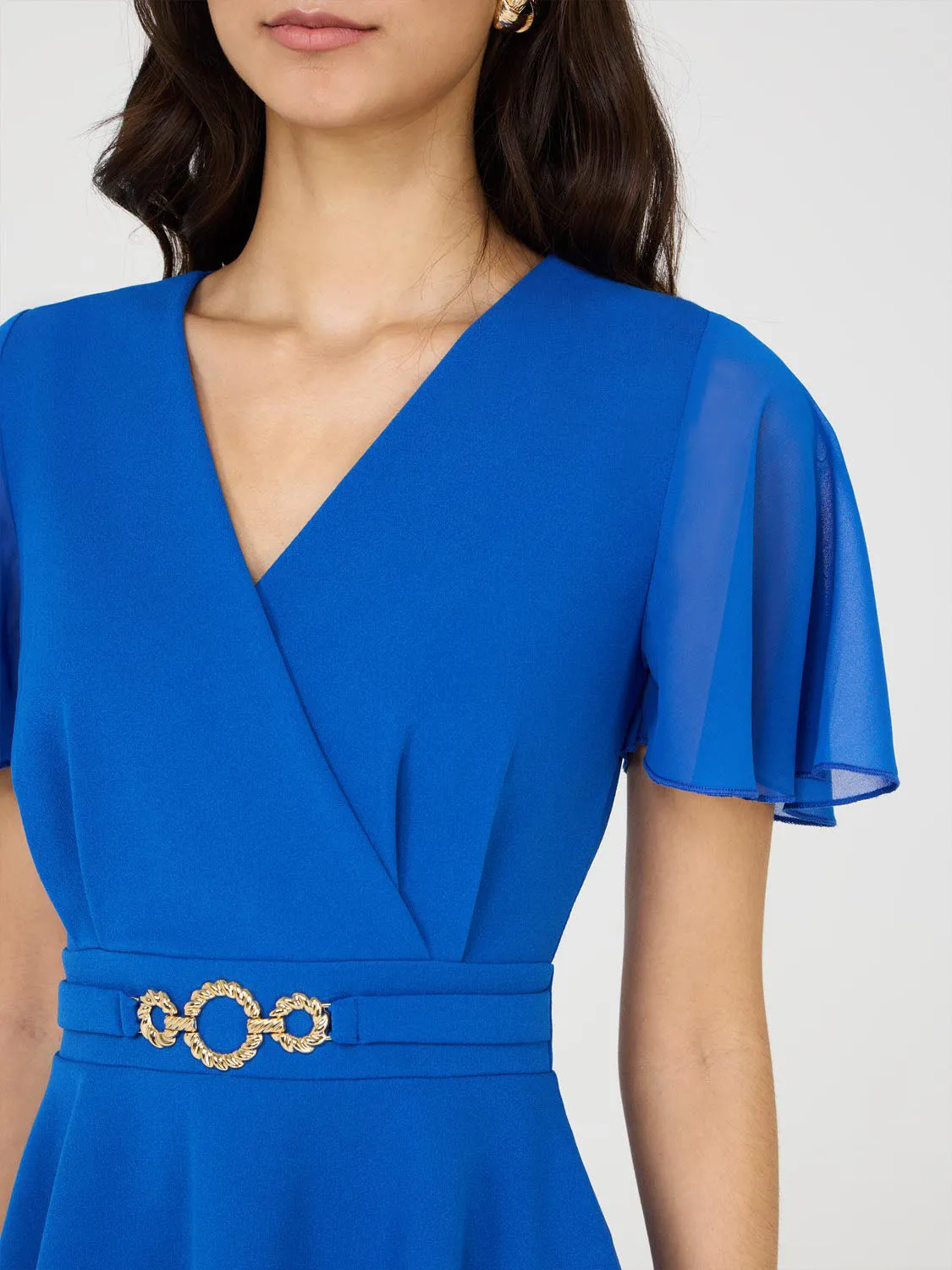 Crossover Peplum Top With Metal Belt