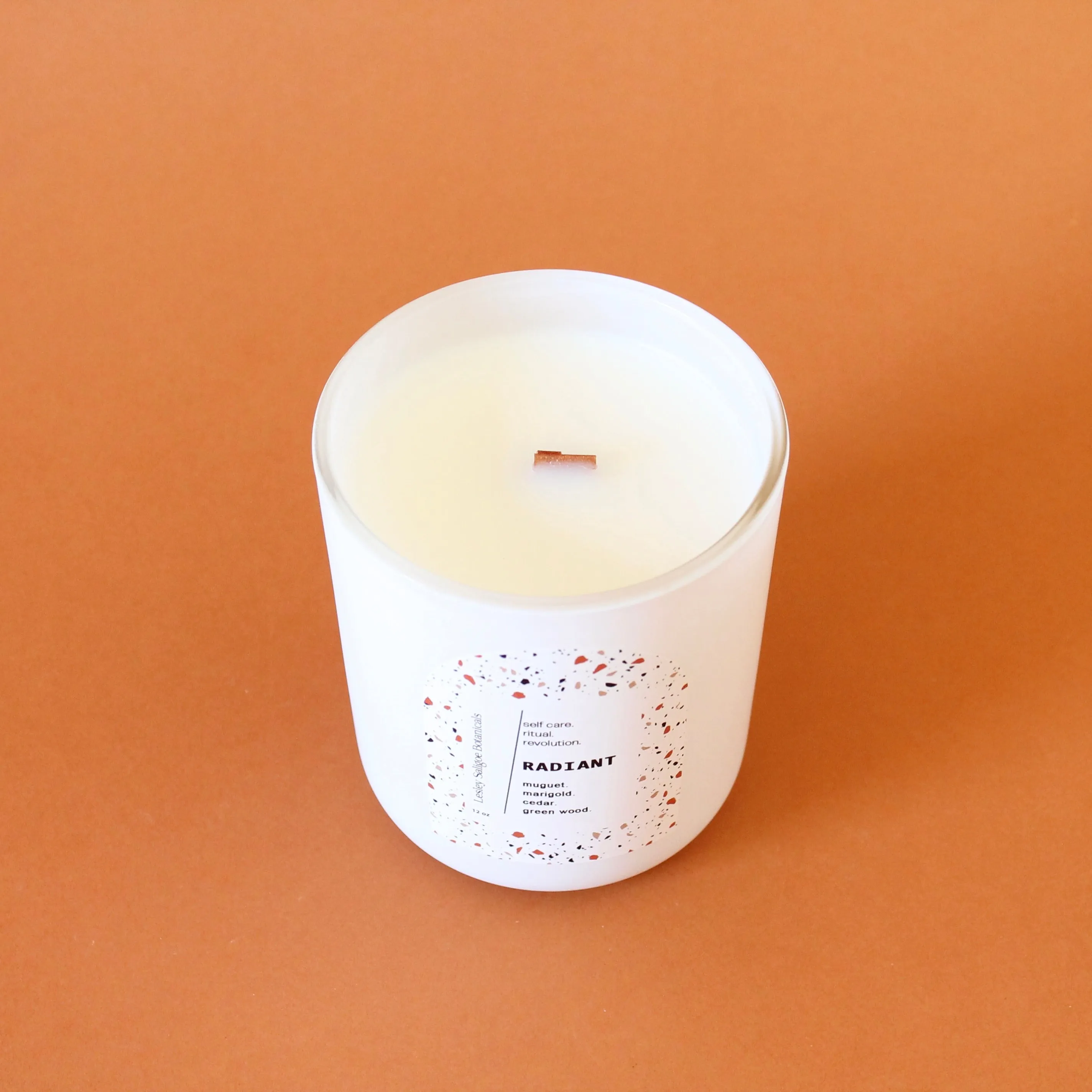 RADIANT Hand Poured Candle. Muguet. Cassis. Cedar. Marigold. Green Wood. Wood Wick. 12 oz. Matte White.